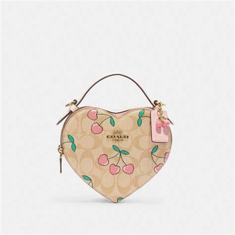 $150 (51). . Cherry heart coach bag